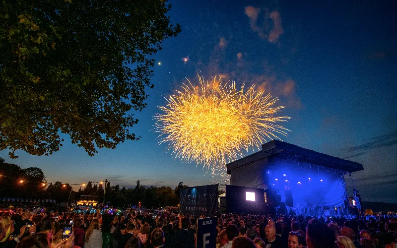 Gold fireworks in the night sky above the Henley festival main stage.