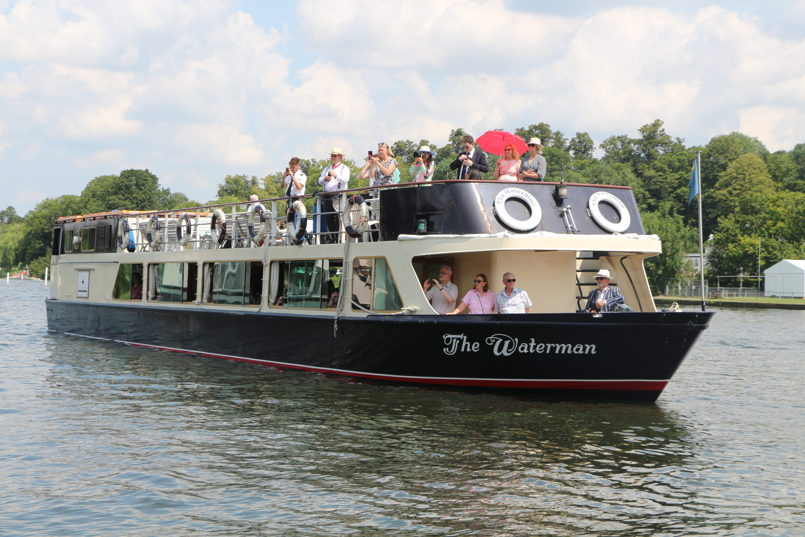 The Waterman on the river thames. Passengers both inside and outside the boat.